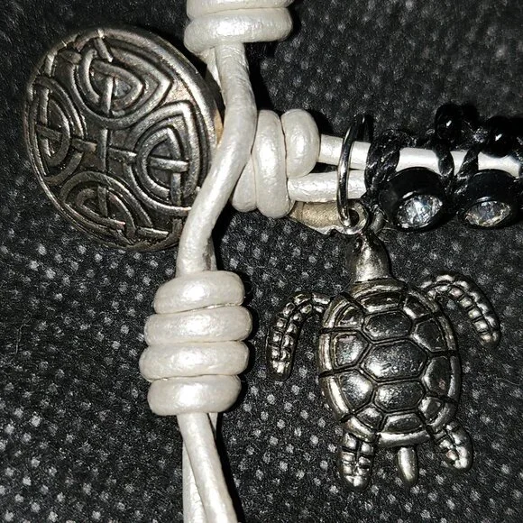Bracelet with Rhinestones Set in Black Beads with White Tie and Turtle Charm - Picture 5 of 9